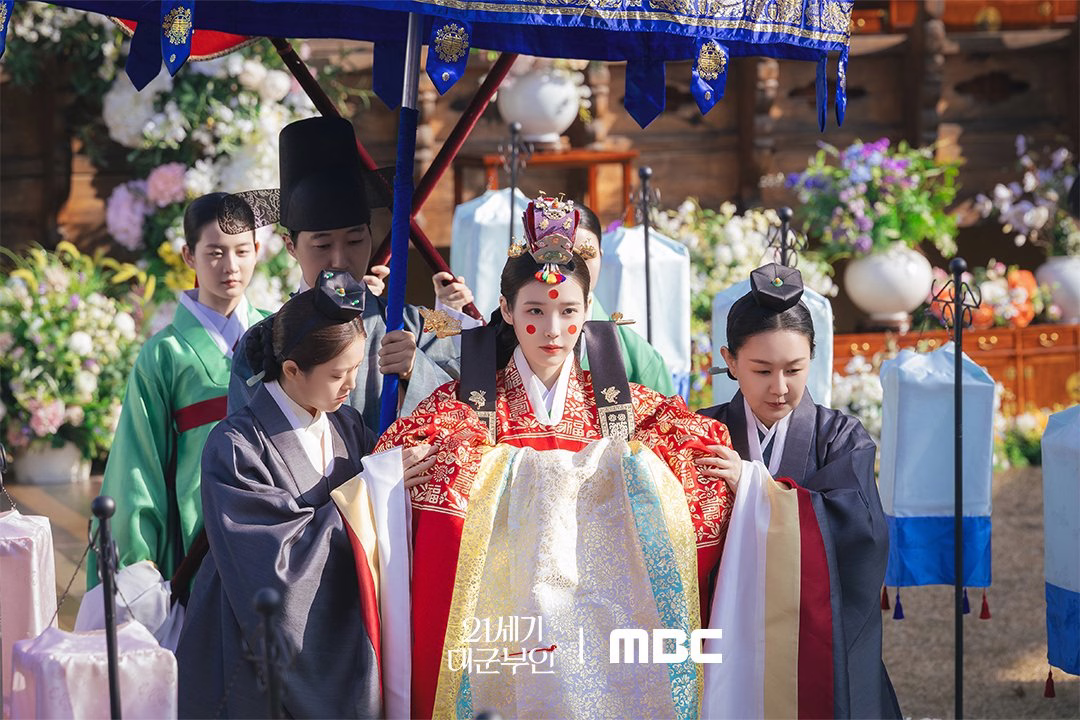 IU and Byeon Woo Seok in traditional wedding attire