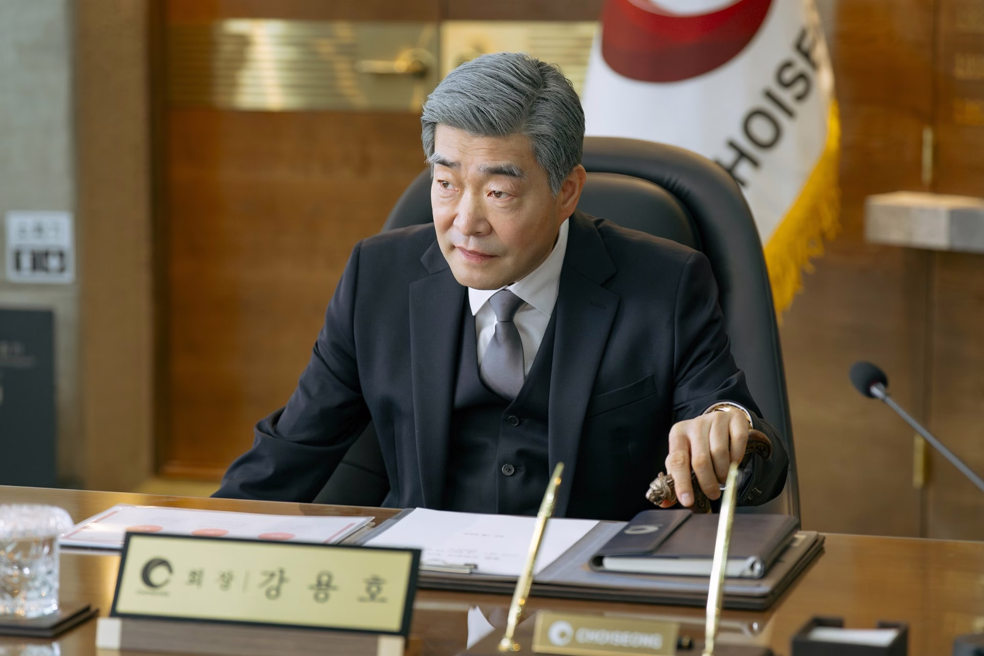 Son Hyun Joo as Kang Yong Ho in a business setting