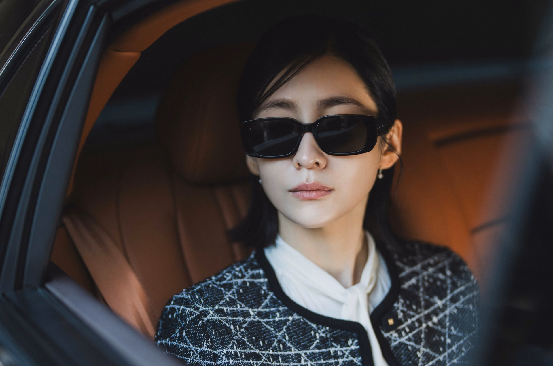 Park Ji Hyun in a luxury car, exuding elegance