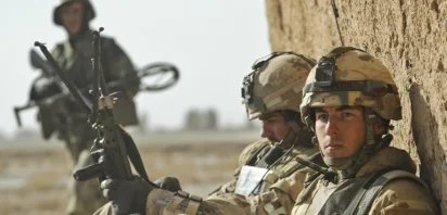 Canadian and Afghan soldiers patrol