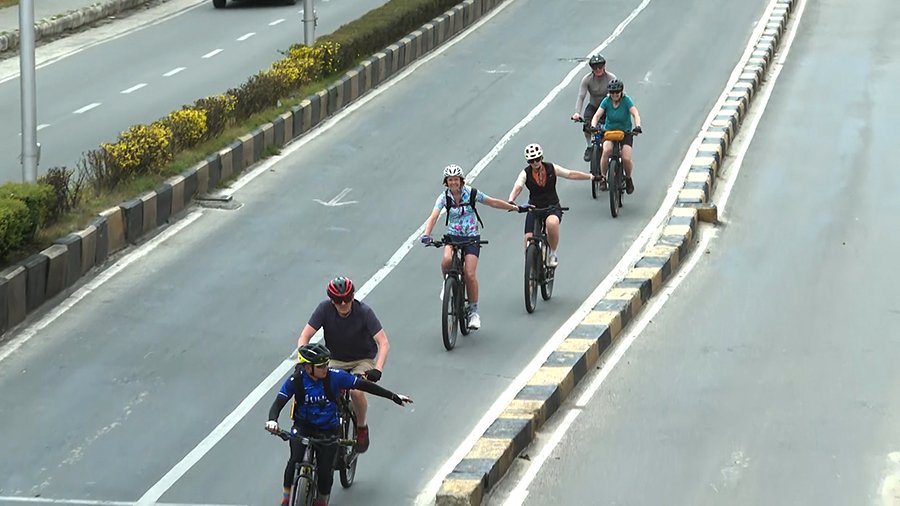 Cyclists enjoying Bhutan's culture