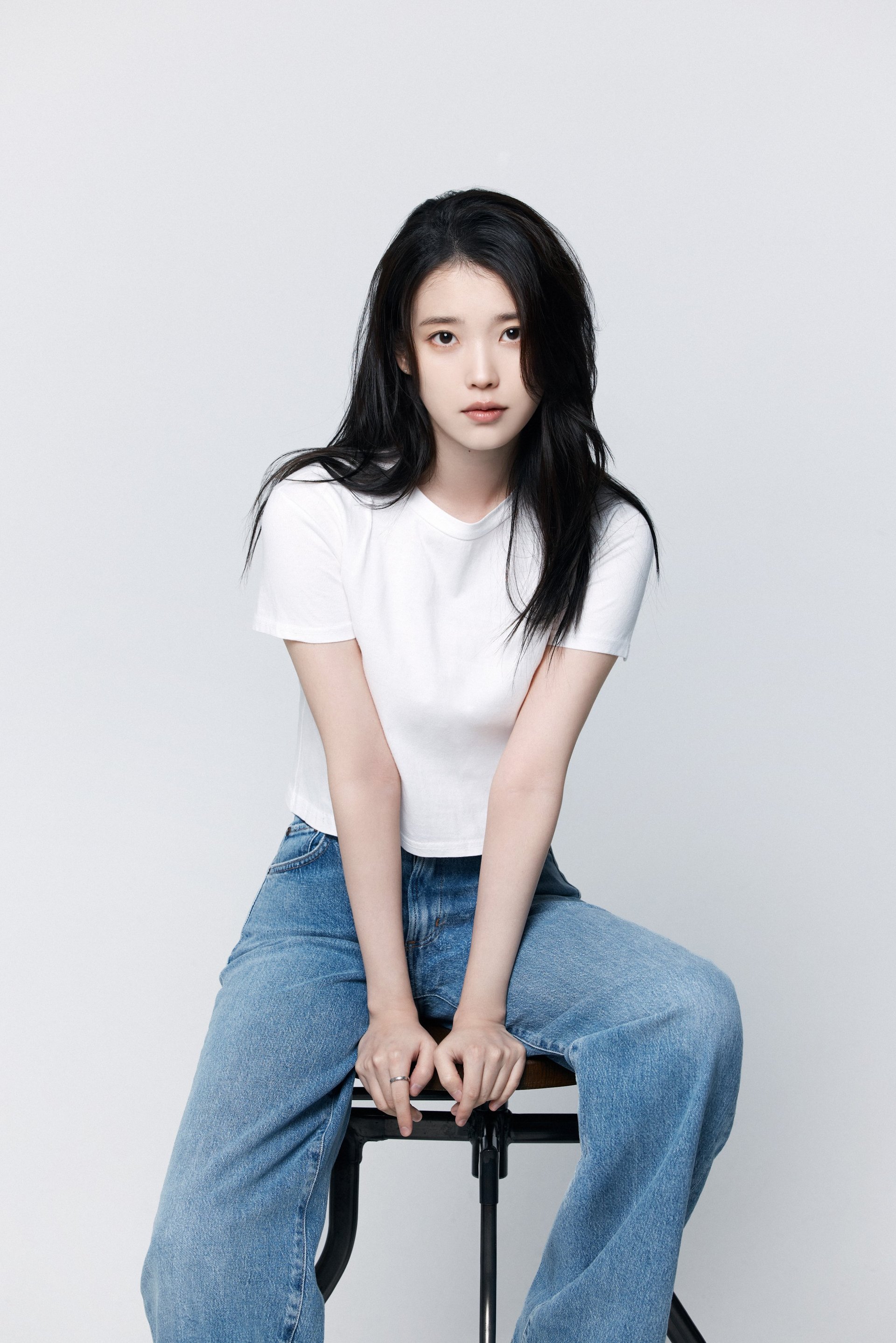 IU in black tank top and heels