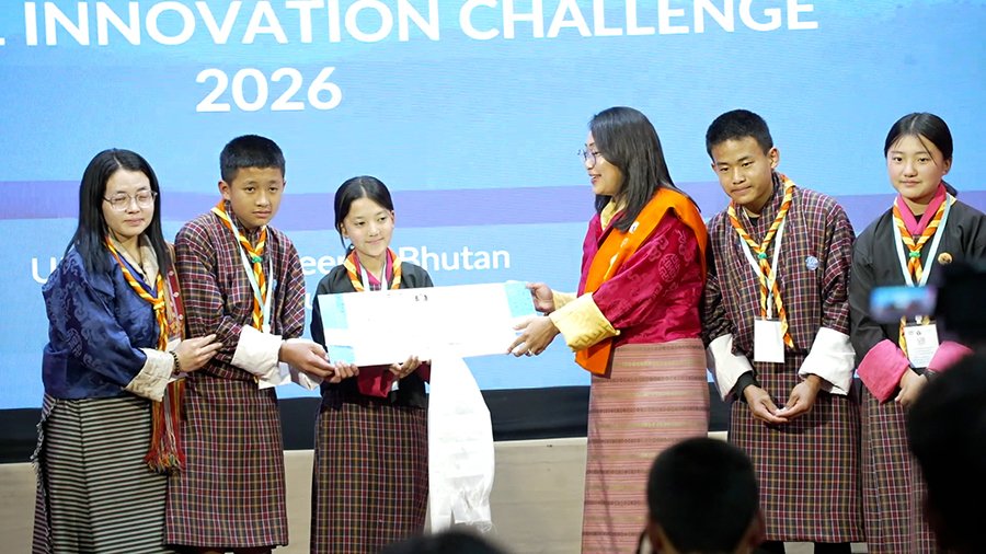 Young innovators showcasing their recycled paper pens