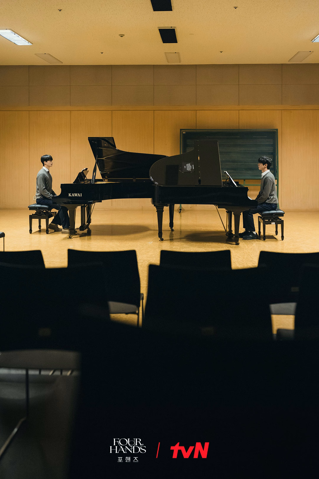 The two pianists prepare for their four-hands performance
