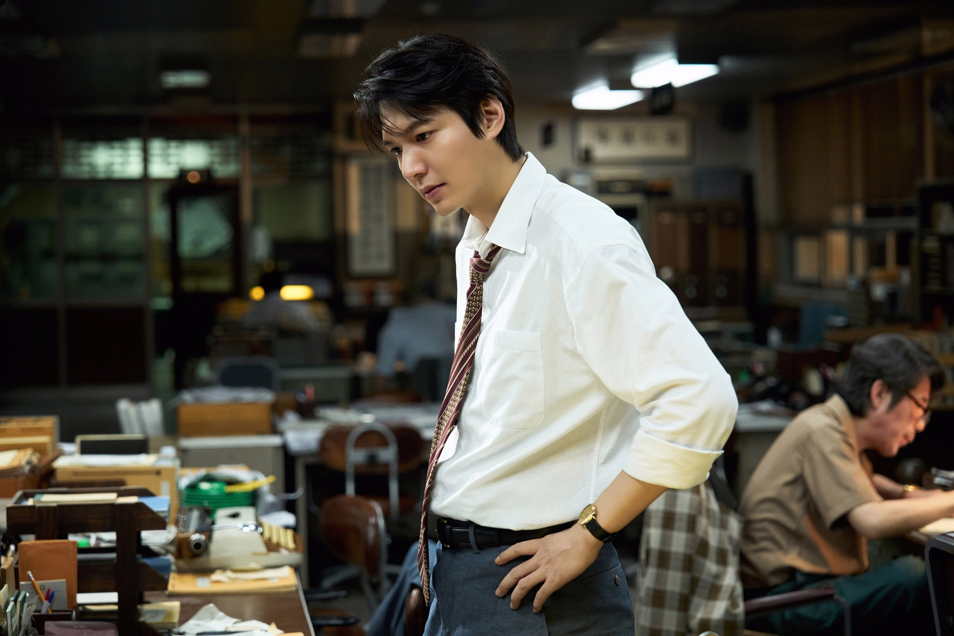 Lee Min Ho as rookie journalist Young Il in the thriller film Assassins