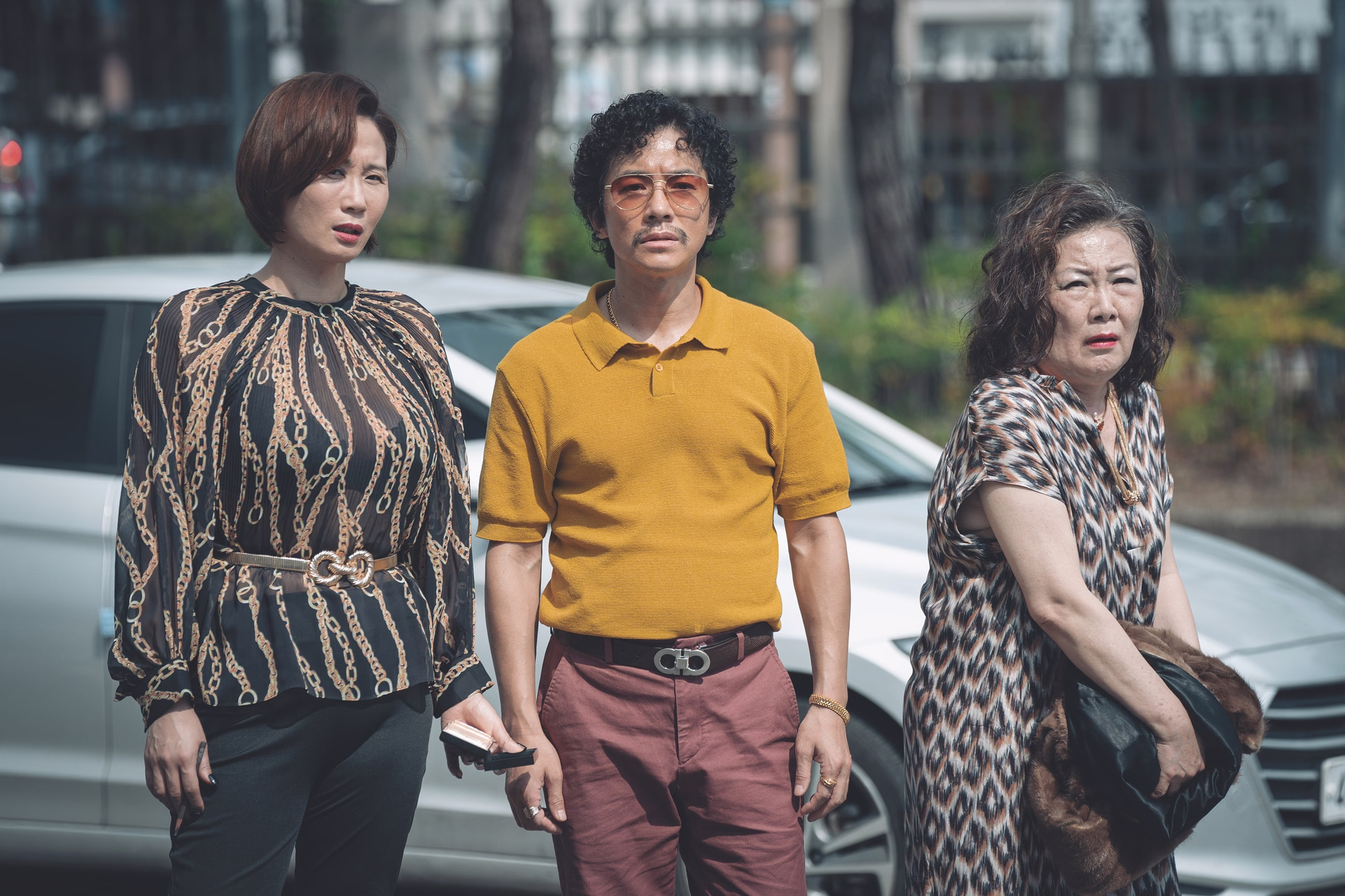Reporter Choi Wook's intense stare in Portrait of a Family