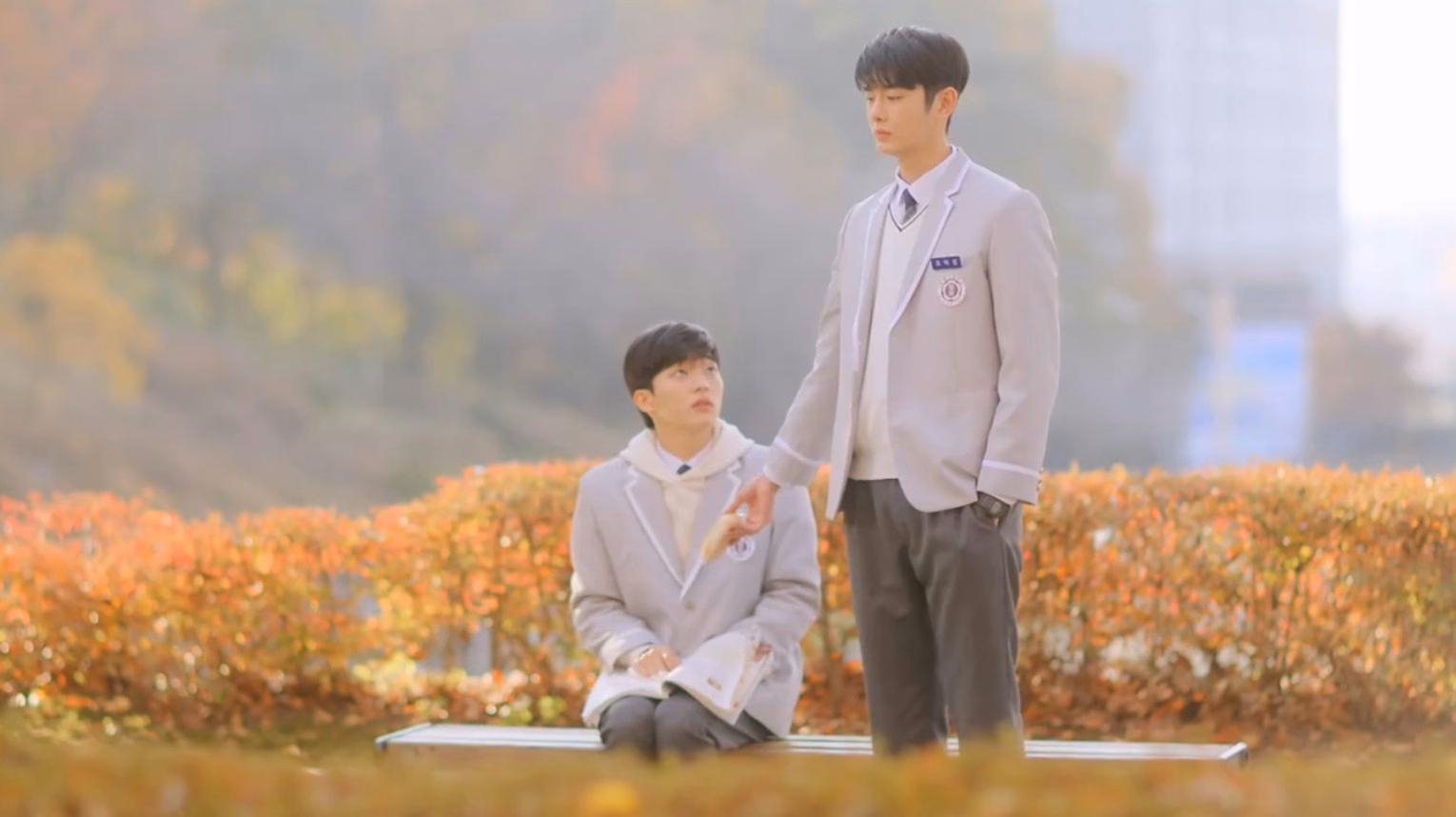 Cherry Blossoms After Winter K-drama showing two male leads in a tender scene