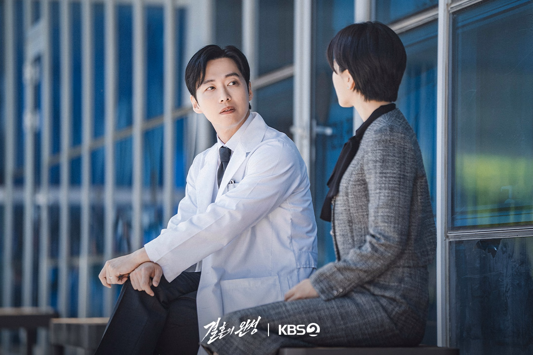 The couple exchanges meaningful glances during their private conversation