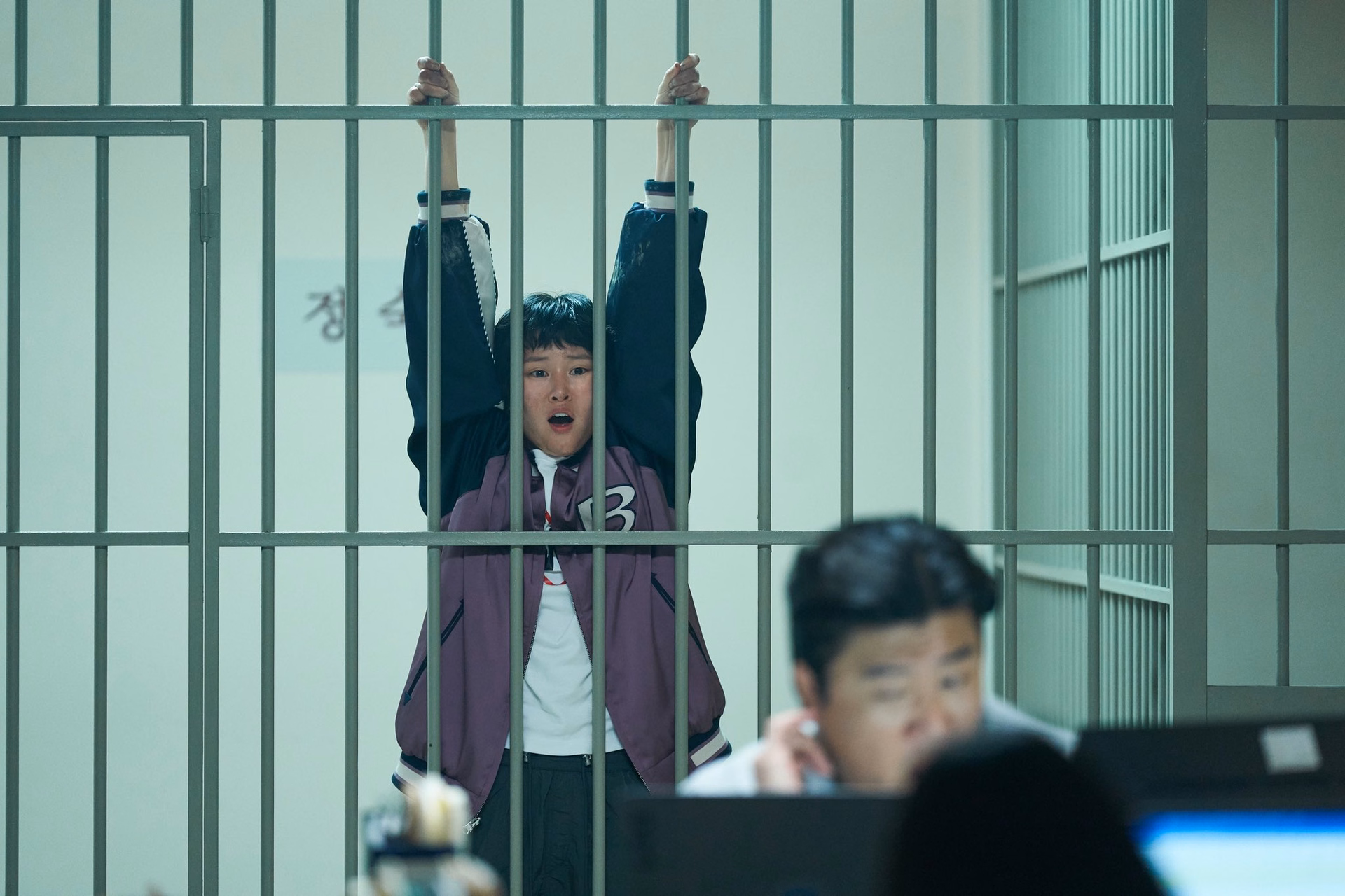 Lee Yeon in character as Dong Ju, displaying her wrestling prowess and action capabilities