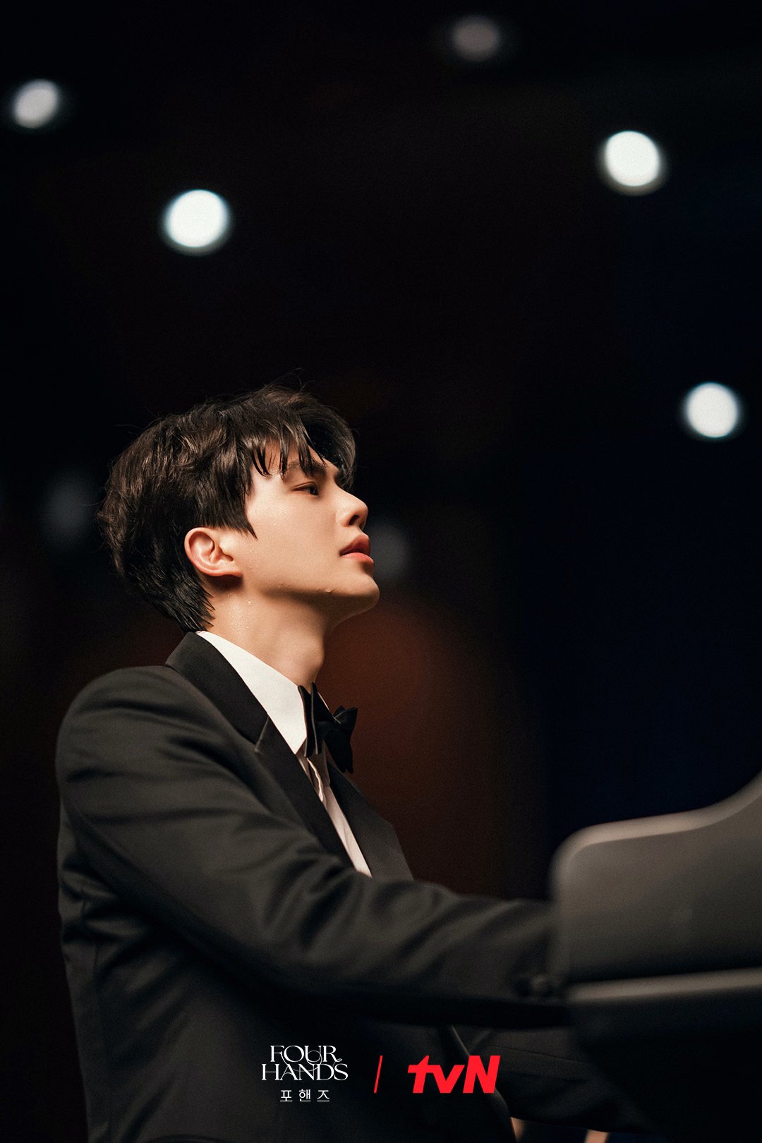 Young pianist concentrating intensely during performance
