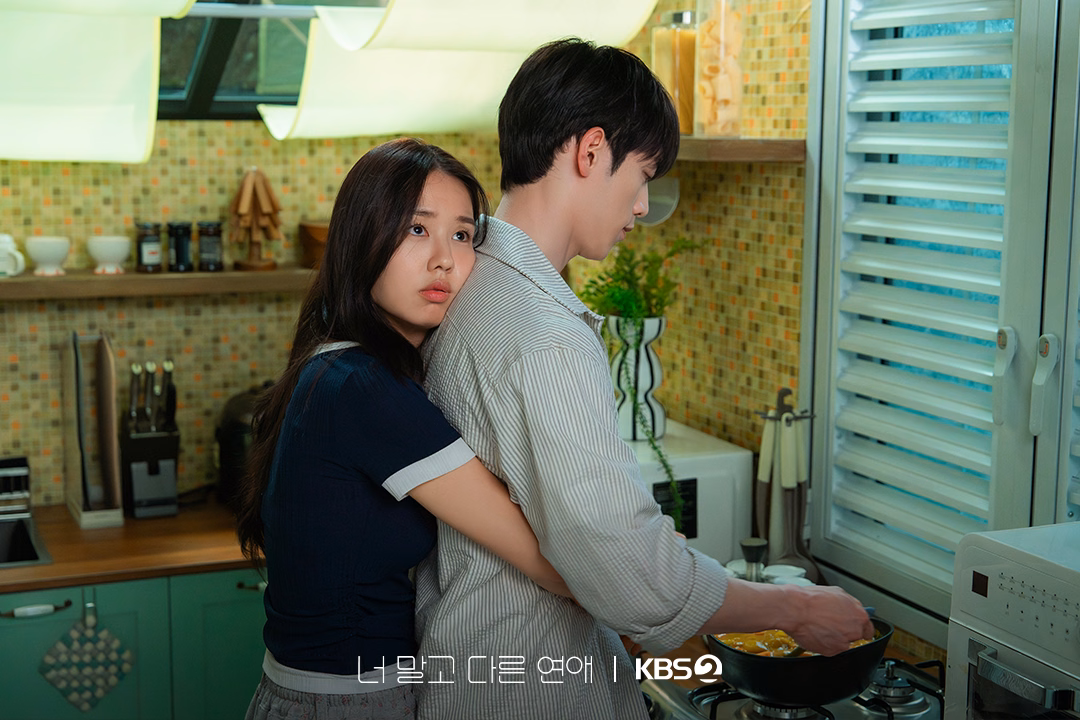 The couple in quiet, intimate moments reflecting established relationship dynamics