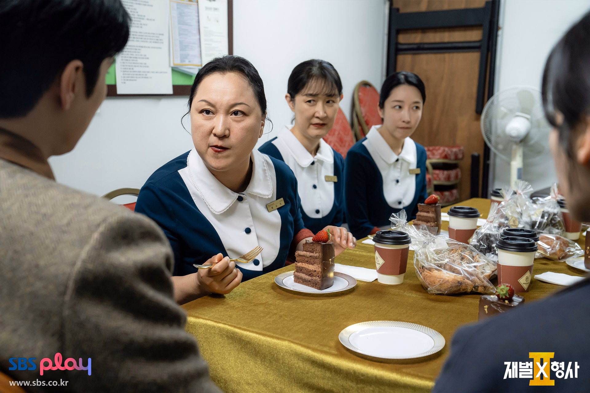 Jin Yi Soo engaging with hotel staff in the break room