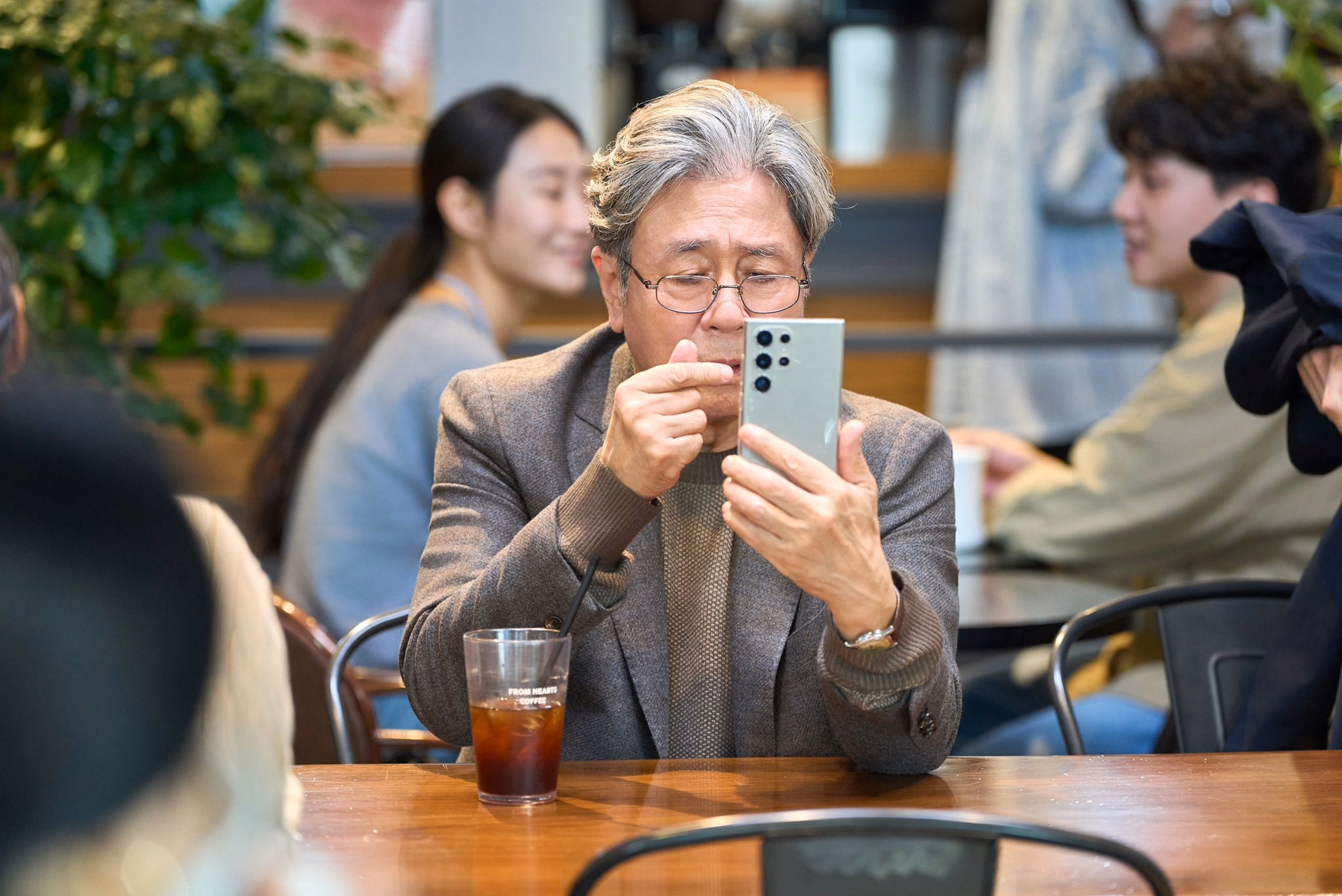 Gi Ho enjoying a snack while observing his colleagues