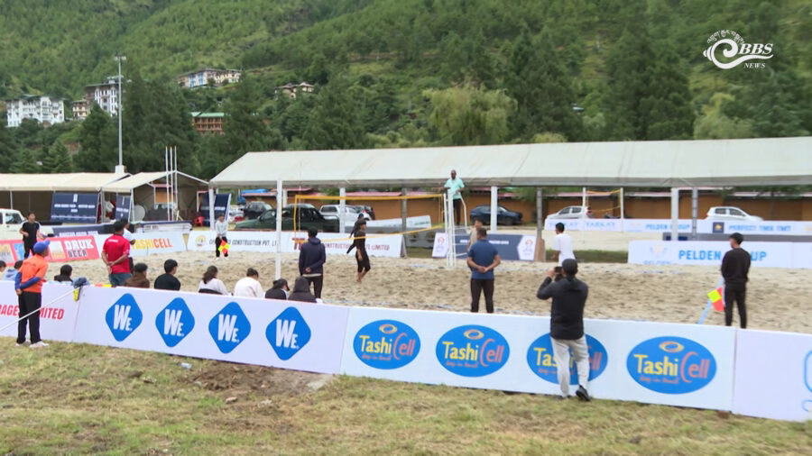 Beach volleyball players in action during warm-up sessions