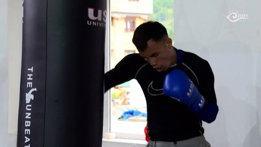 Boxer Migma Dorji demonstrating punching technique during training