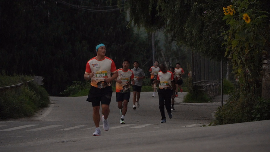Runners gathering at the start of the Thimphu Marathon event in early morning