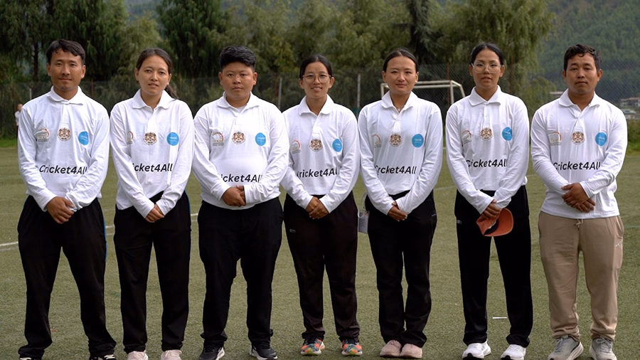 Monks and nuns participating in cricket coaching training session