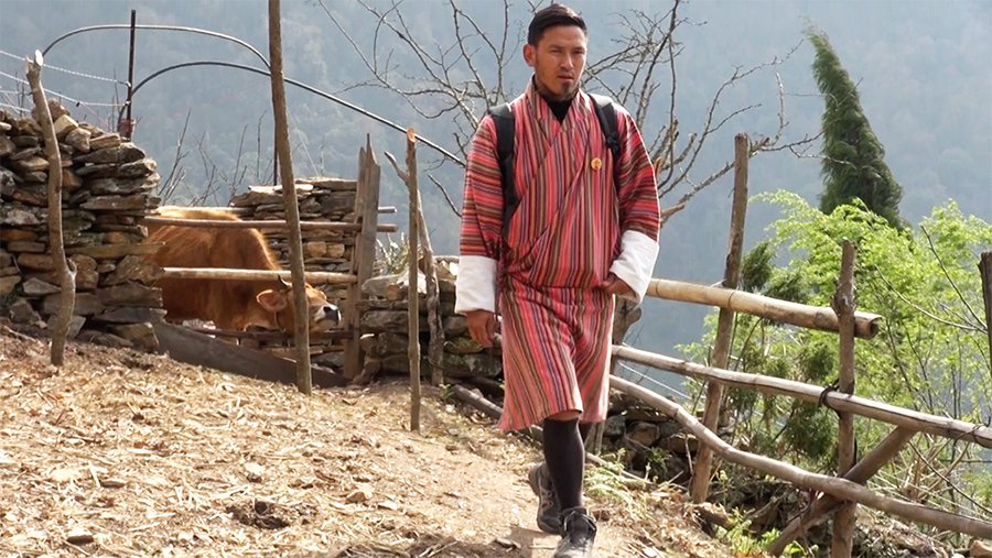 Dawa Tshering walking through the forest