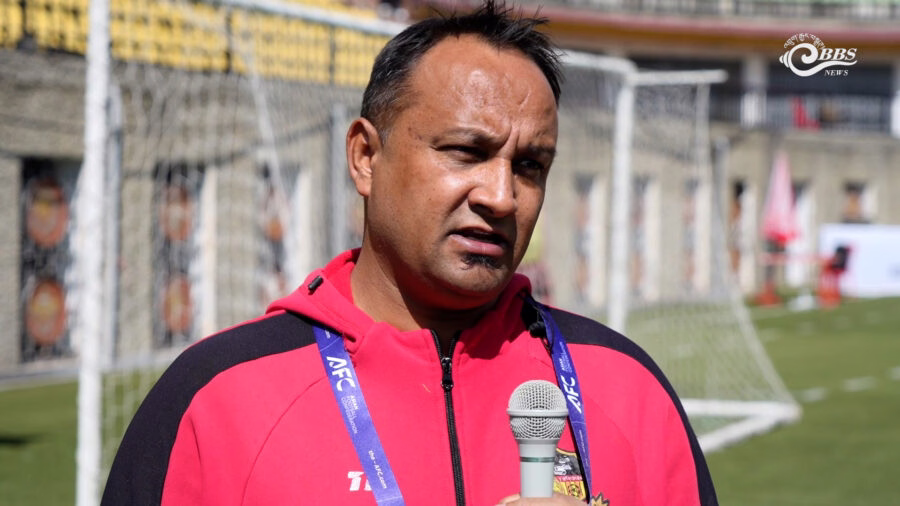 Coaching staff and players during pre-match preparations