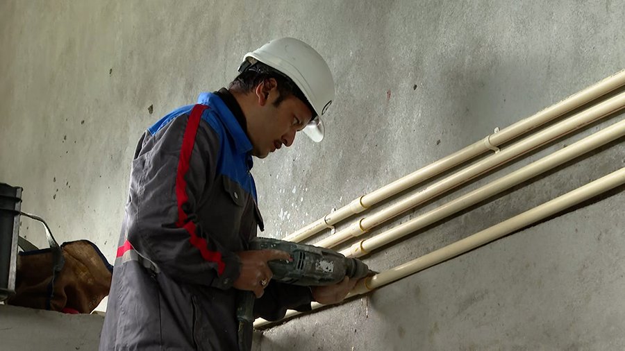 Electricians working on a project