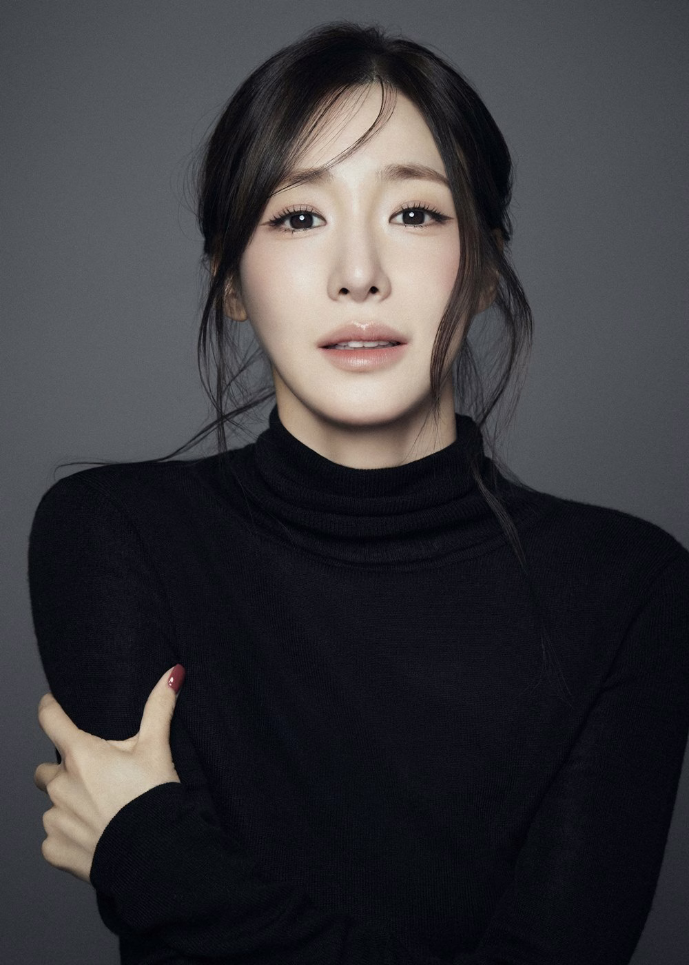 Tiffany Young in a black turtleneck and jeans