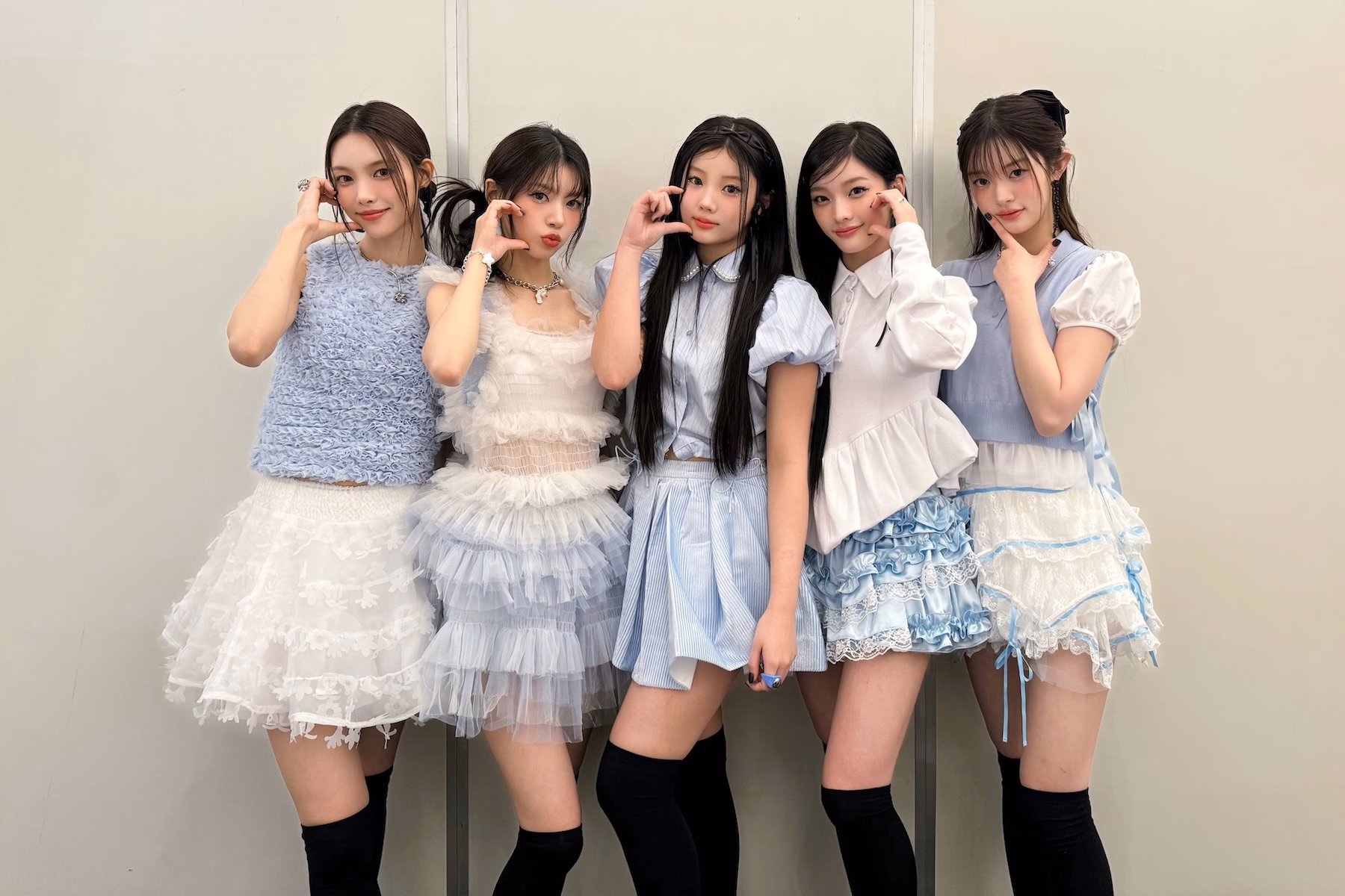 Rei of IVE in a blue-and-white dress